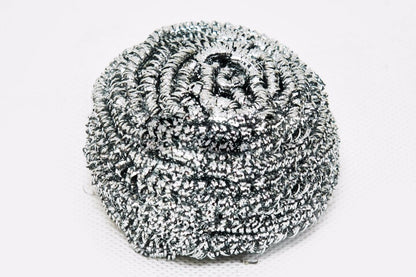 Round stainless steel scrubber showing its intricate wire design for superior scrubbing.