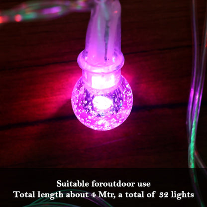Close-up of twinkling LED bubble ball decorative string lights illuminating space